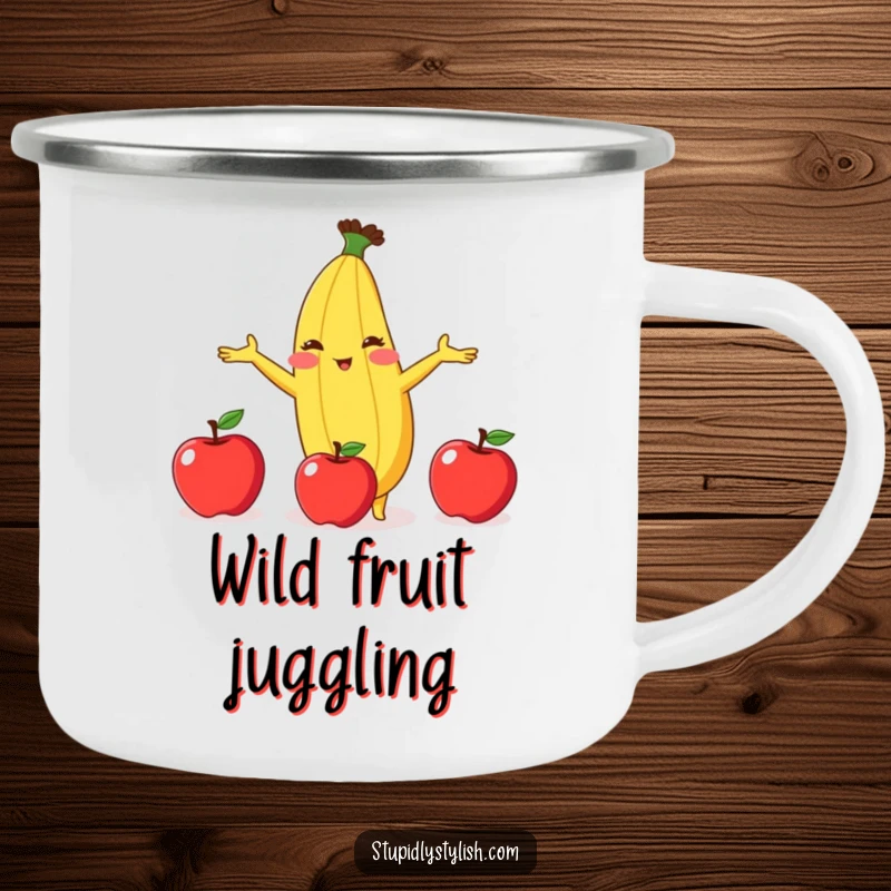Funny enamel camping mug featuring a blushing banana attempting to juggle three apples, perfect for outdoor antics and laughter.