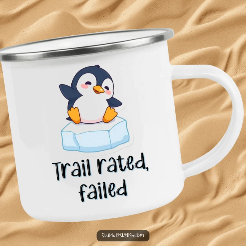 Funny camping mug depicting a clumsy penguin slipping on an ice cube, perfect for outdoor adventures with humor.