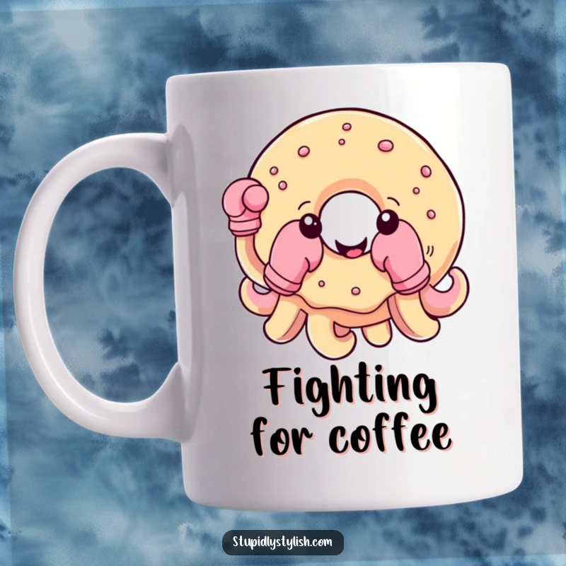 Funny mug featuring a cheerful, round donut with boxing gloves on its tentacles, ready to take on the day.