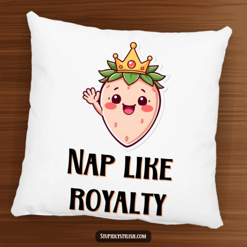 Funny pillow with a happy strawberry character wearing a crown, waving cheerfully, designed for ultimate comfort and joy.