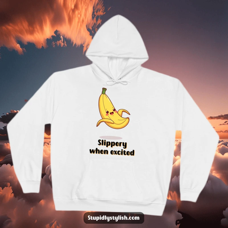 Funny Hoodie illustrating a silly banana caught in a dramatic slip on a peel, providing cozy comfort and a humorous, cartoonish visual.