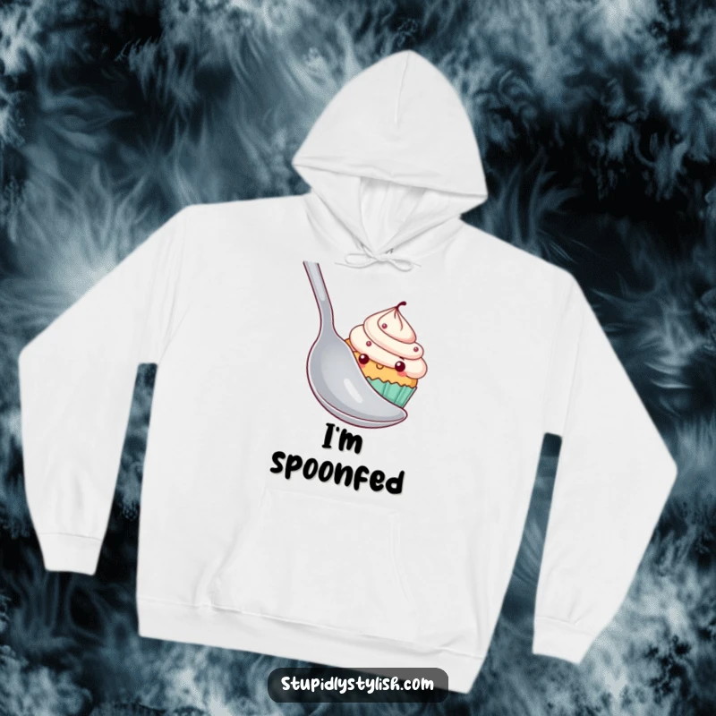 Funny shy cupcake hoodie featuring a cupcake character hiding behind a giant spoon, offering warmth and a touch of endearing humor.