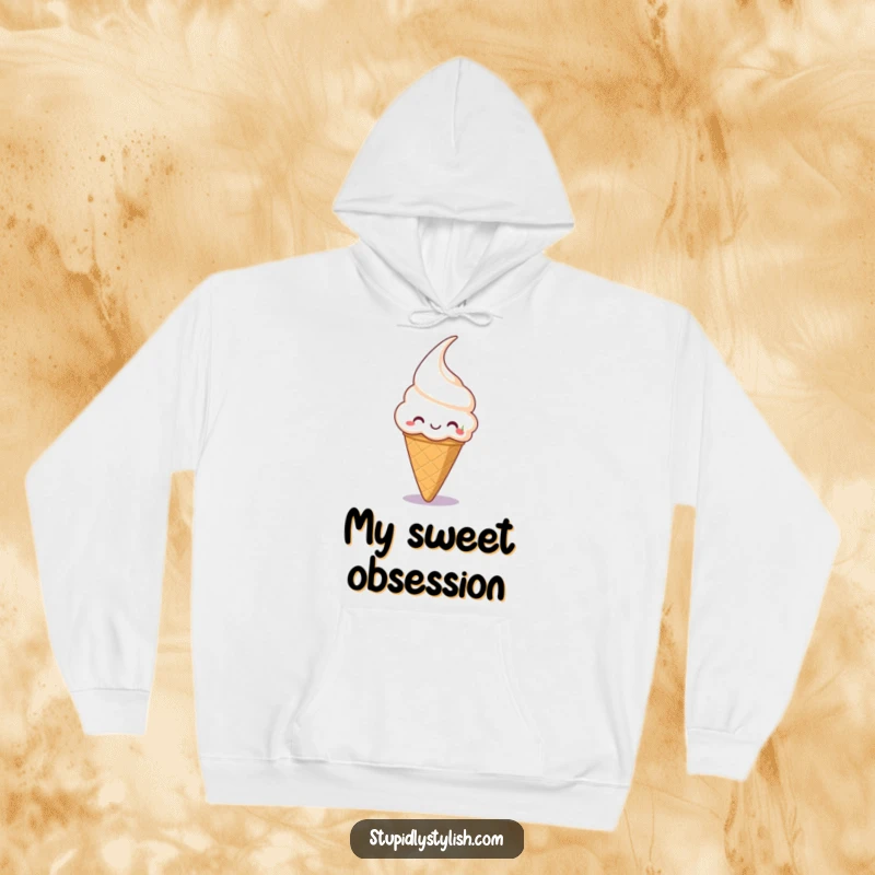Funny hoodie featuring a cute ice cream cone with a big grin, trying to catch a cherry, for sweet comfort.