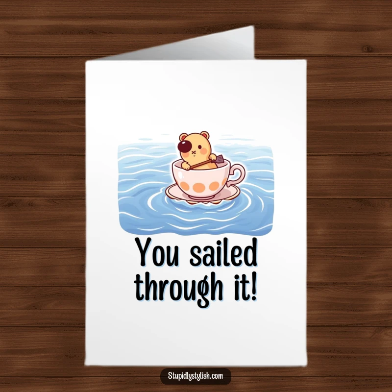 Funny Free Printable Congratulations Card showing a determined hot dog navigating a teacup across a massive ocean, symbolizing achievement.