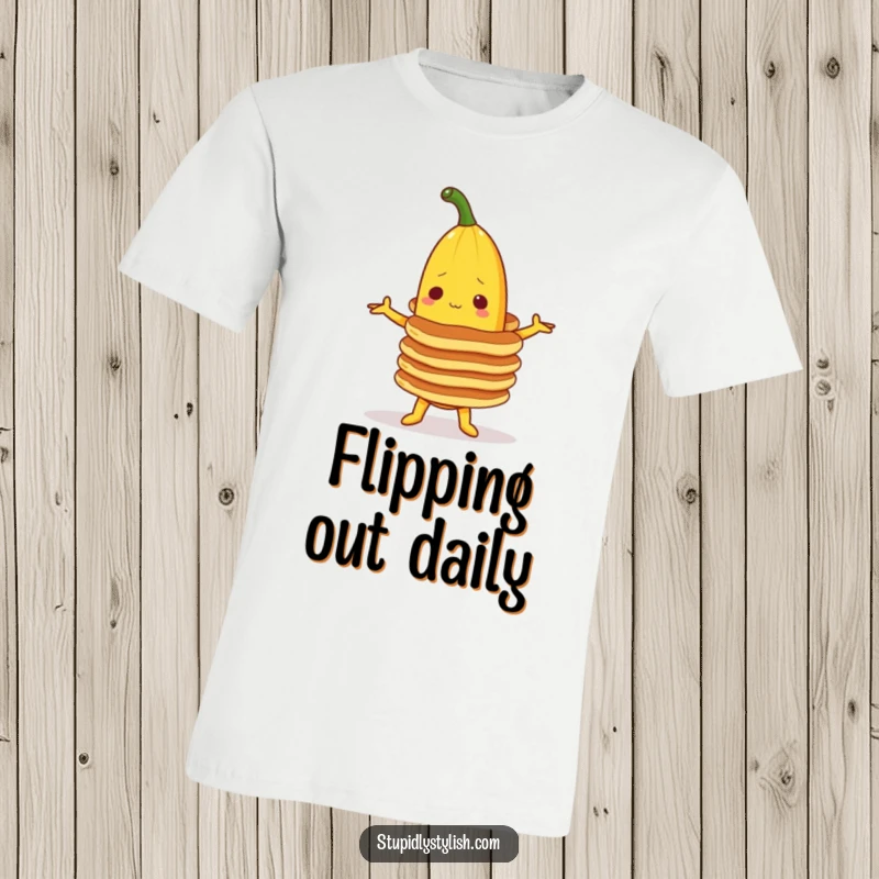Funny t-shirt with a banana character attempting to balance a precarious stack of pancakes, illustrating breakfast challenges with humor.