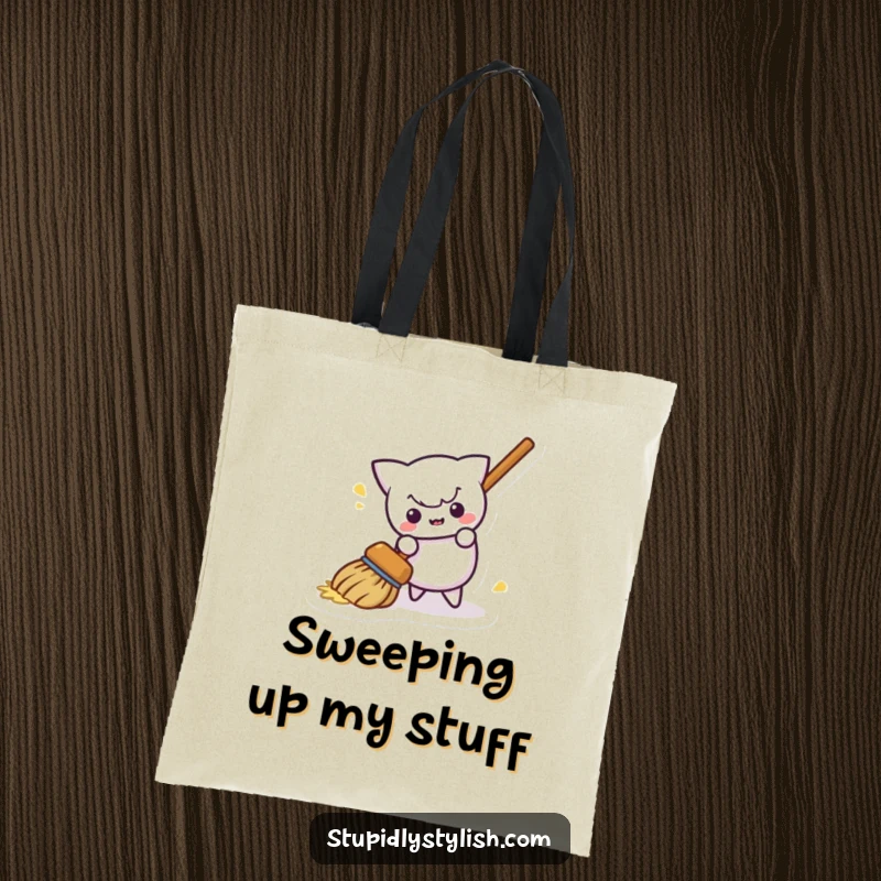 Funny tote bag showcasing a mischievous broom hilariously sweeping itself away, perfect for stylish and humorous everyday use.